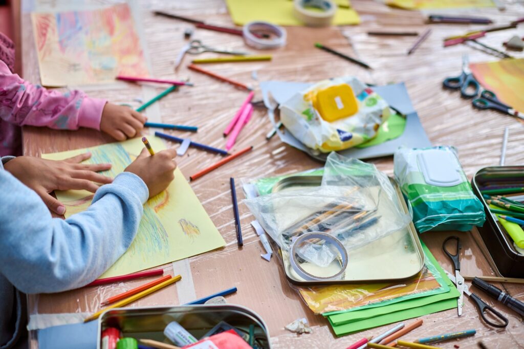 Creative workshop children engaged in painting activity